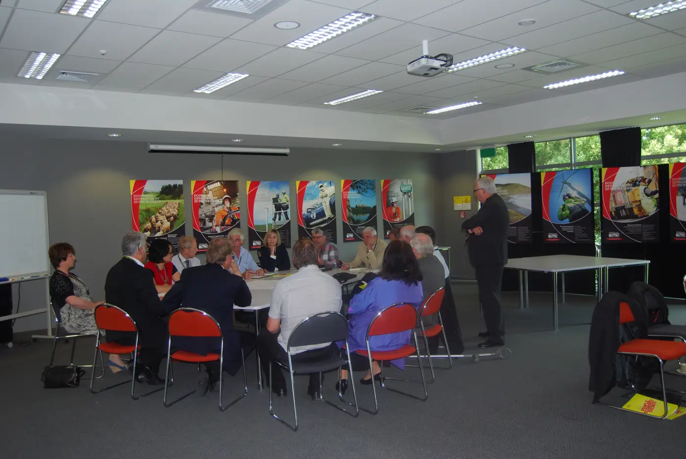 a group of people sitting around a table