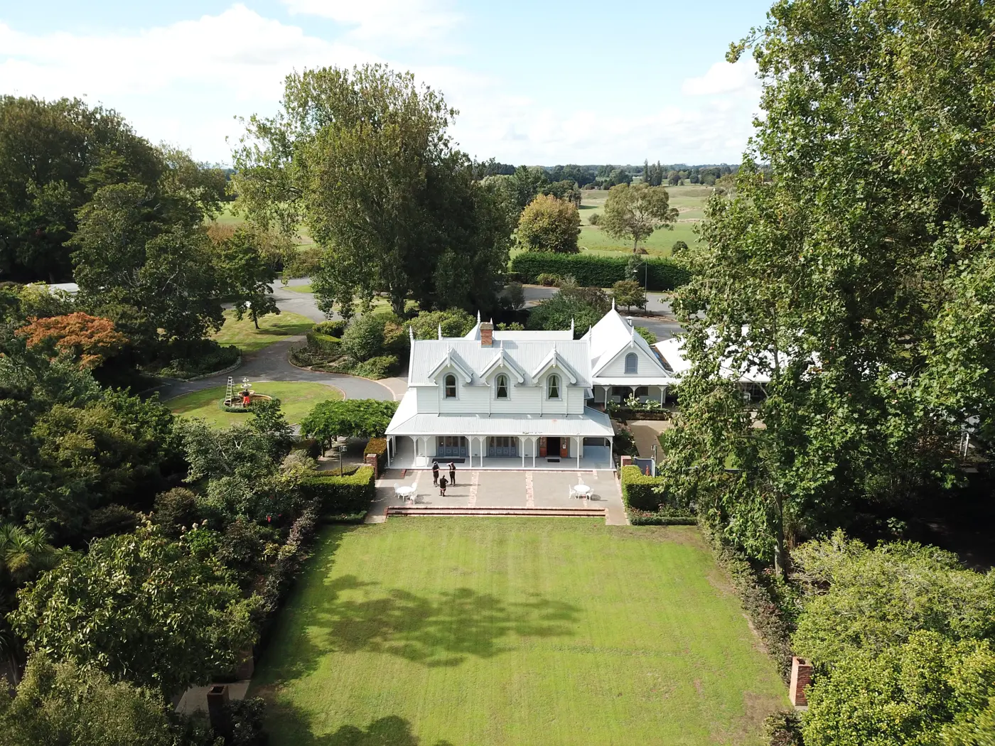 a house with a lawn and trees