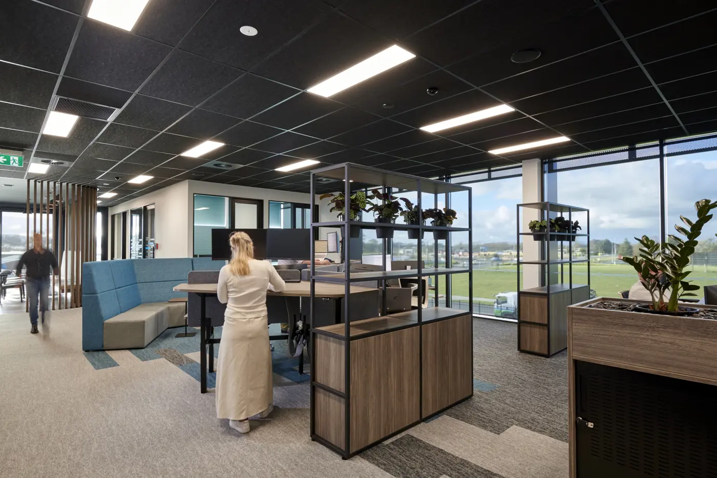 a woman standing in an office