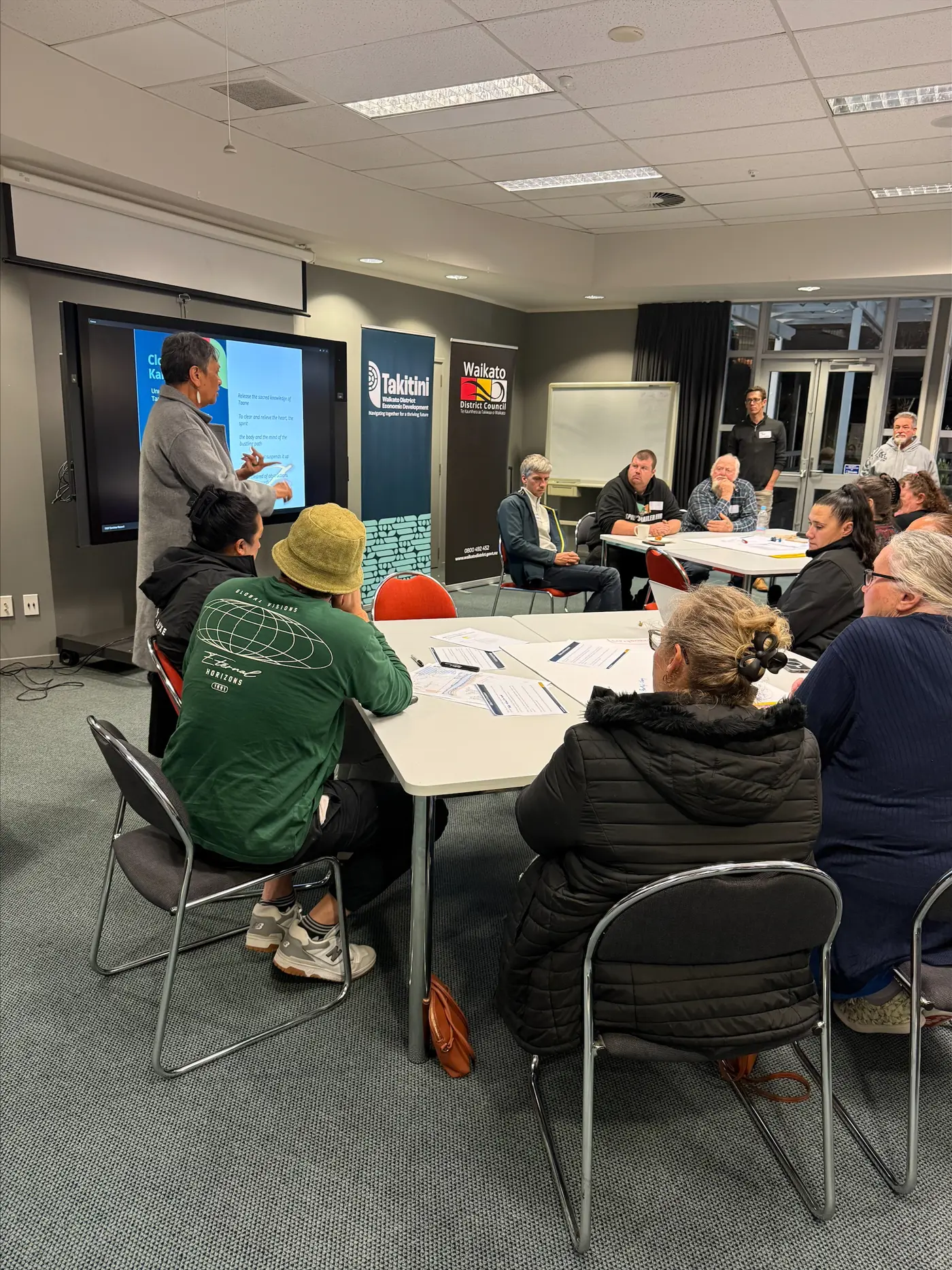 a group of people sitting around a table