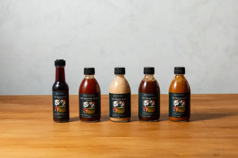 a group of bottles of sauces