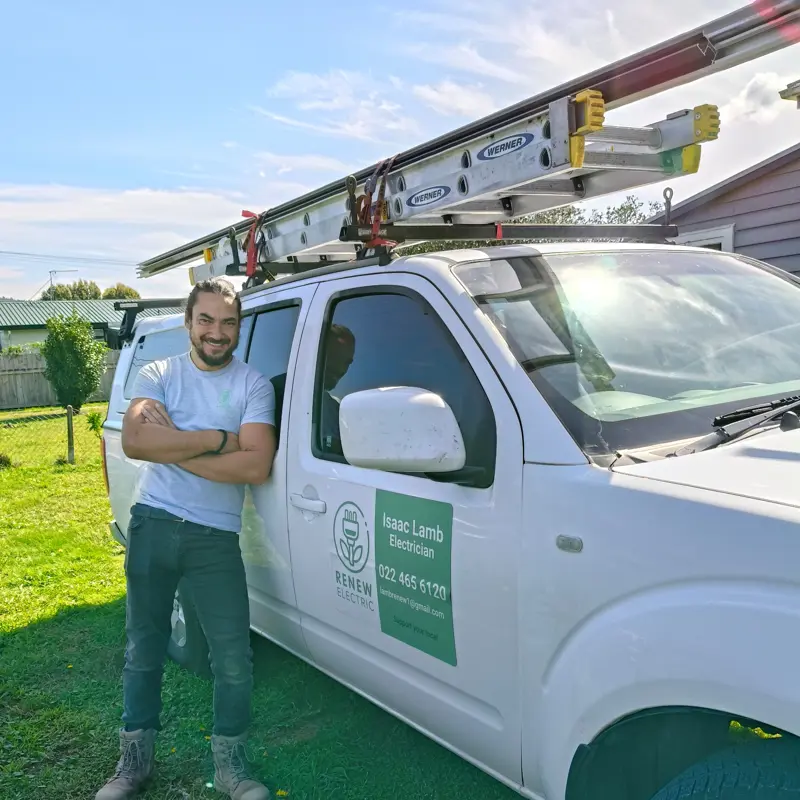 a man standing next to a white truck