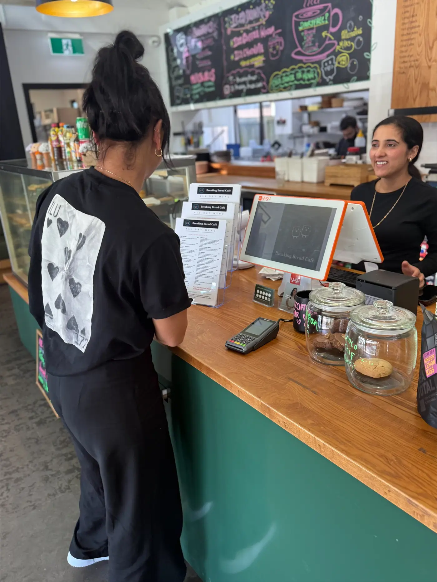 a woman standing at a counter