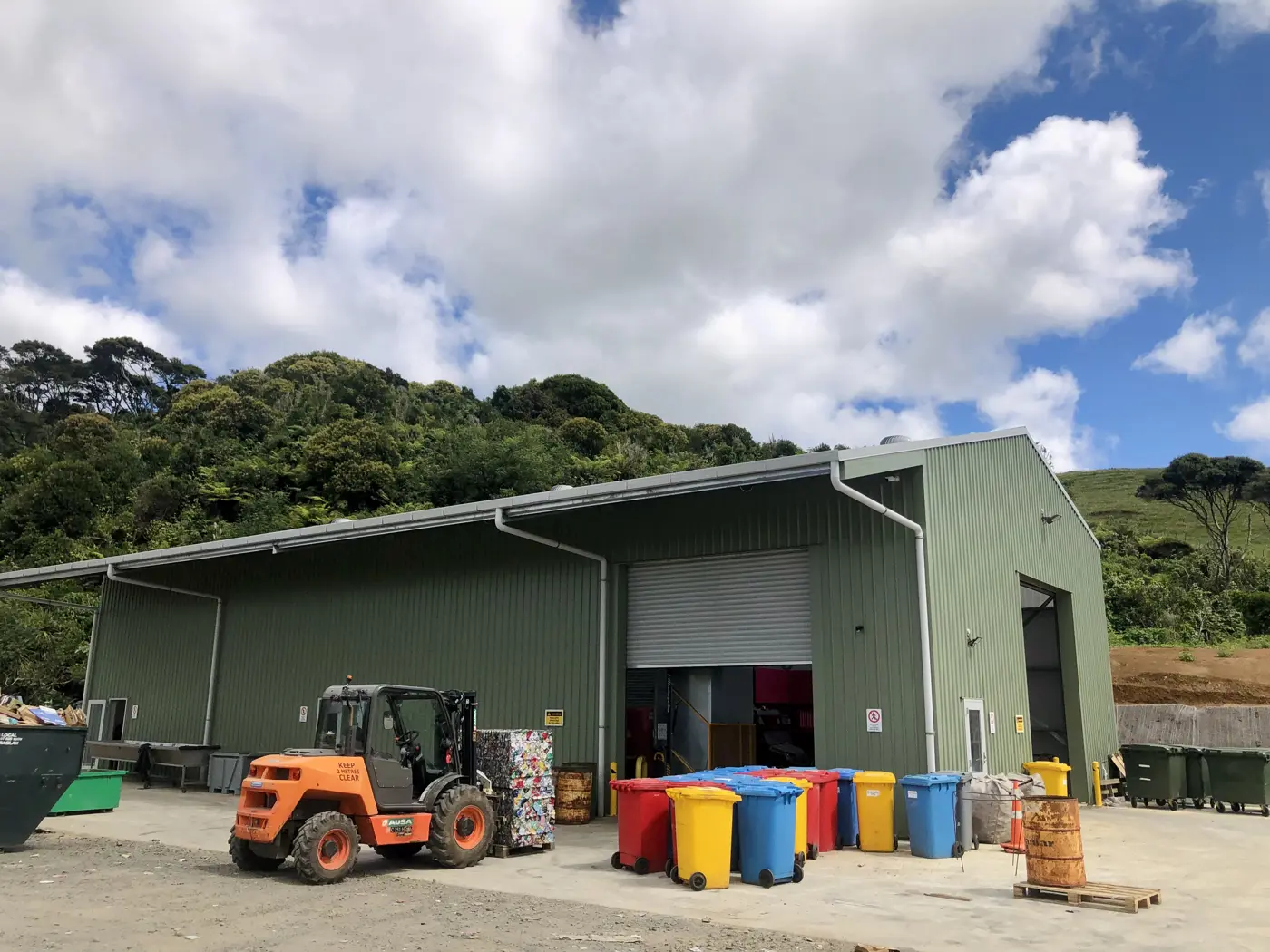 a building with many bins and a forklift