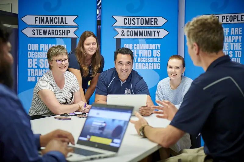 a group of people sitting around a table