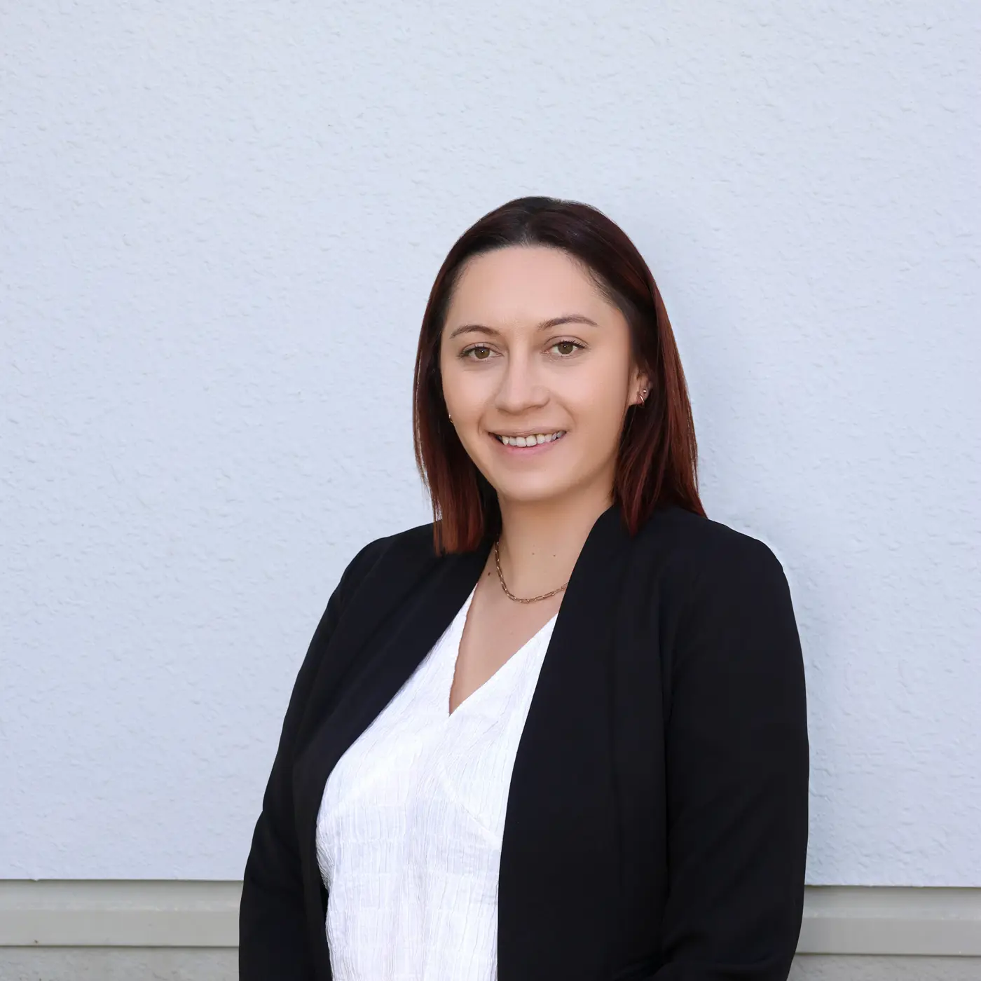 a woman in a black jacket