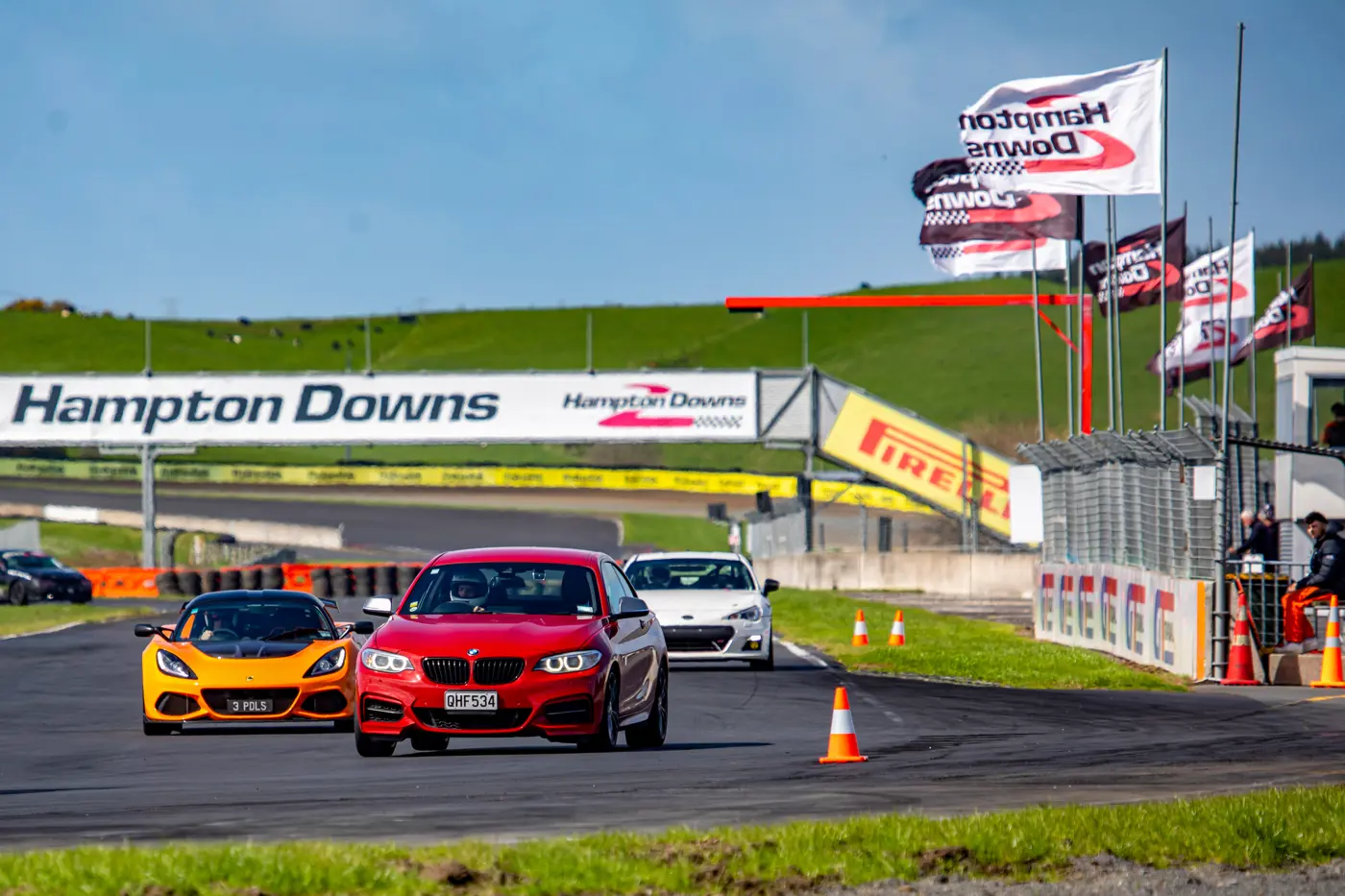 a group of cars on a race track
