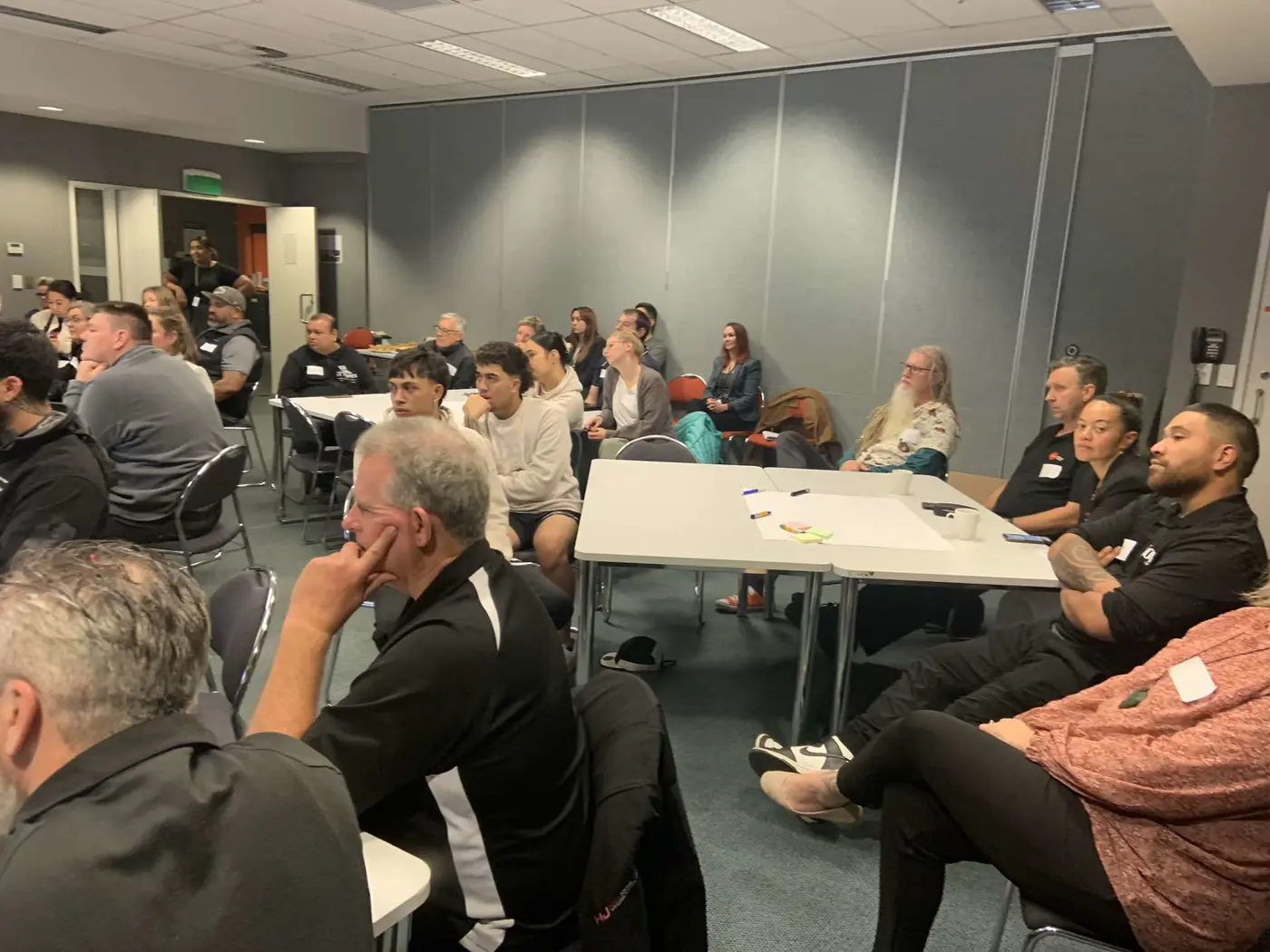 a group of people sitting in a room