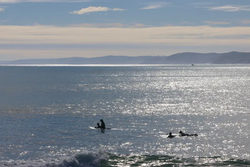 people on surfboards in the ocean