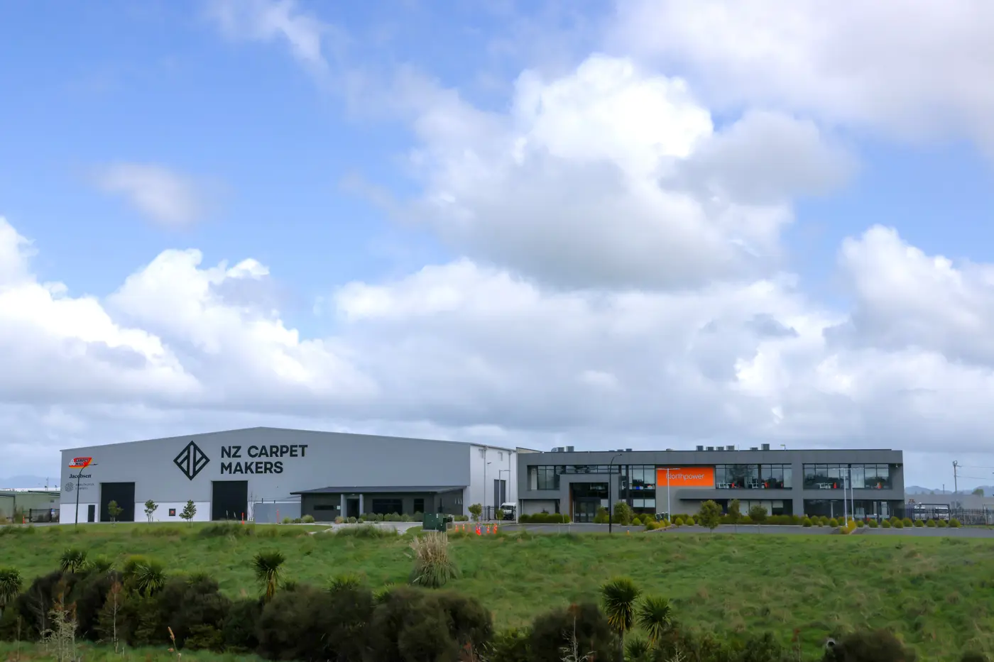 a building with a grassy area