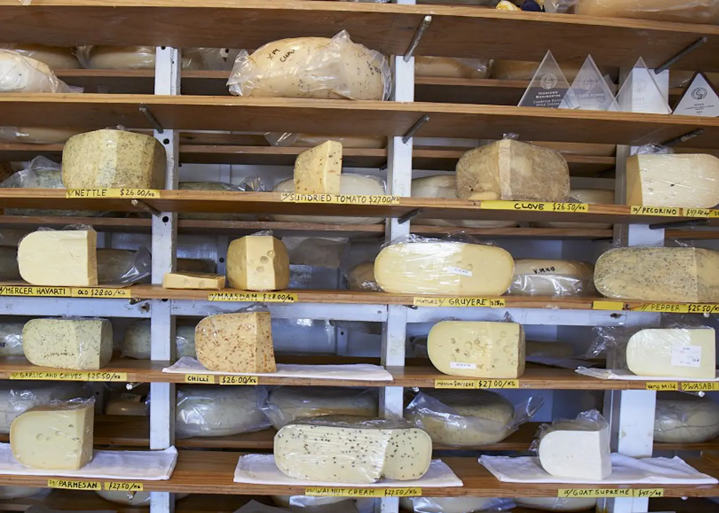 a shelf with cheese on it