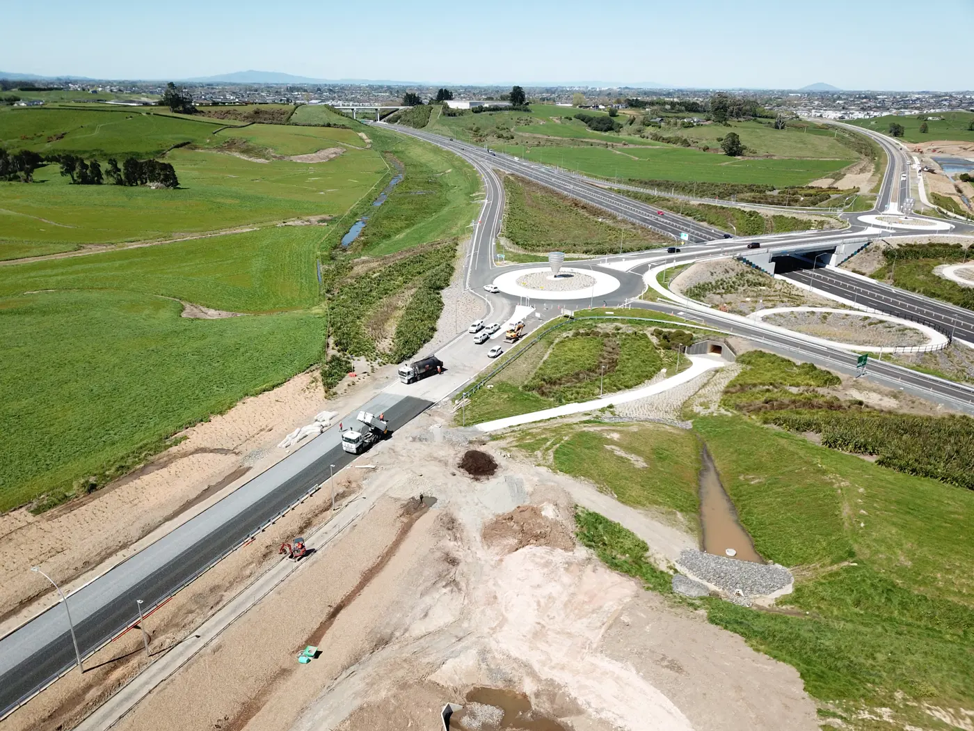 a road with a bridge and a bridge