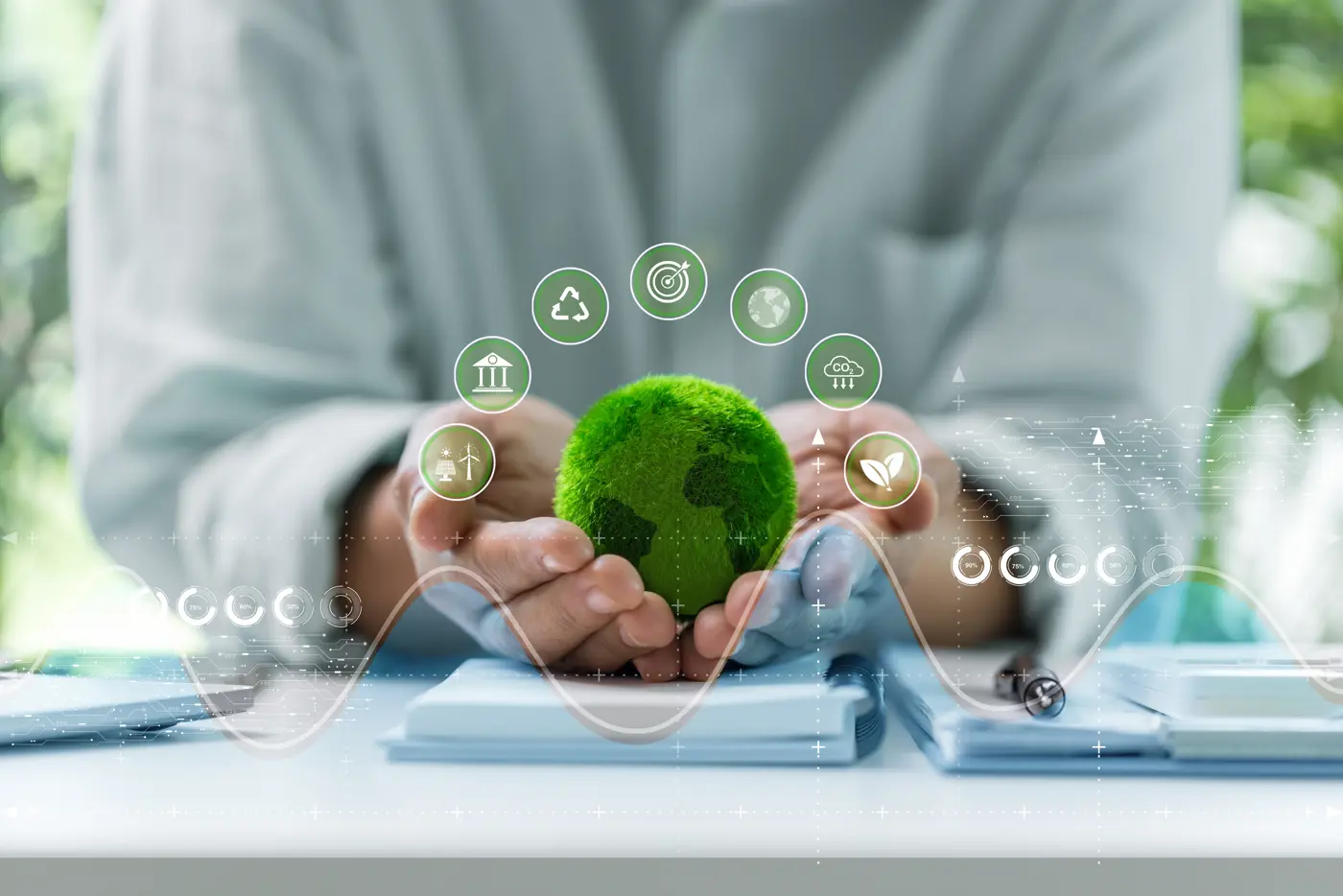 a person holding a small green planet