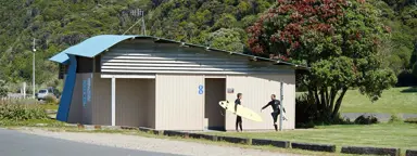 a group of people holding surfboards
