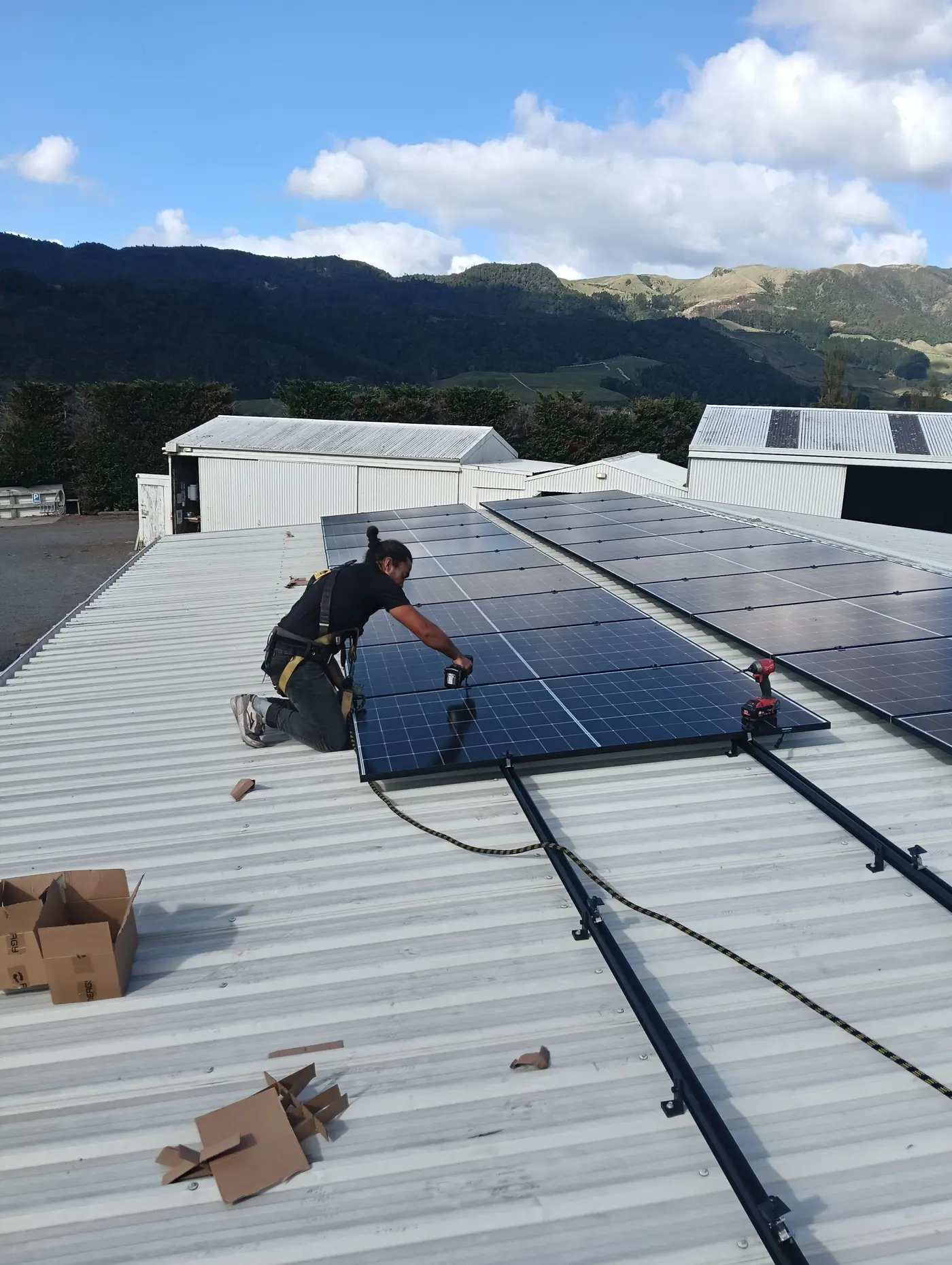 a man working on a solar panel