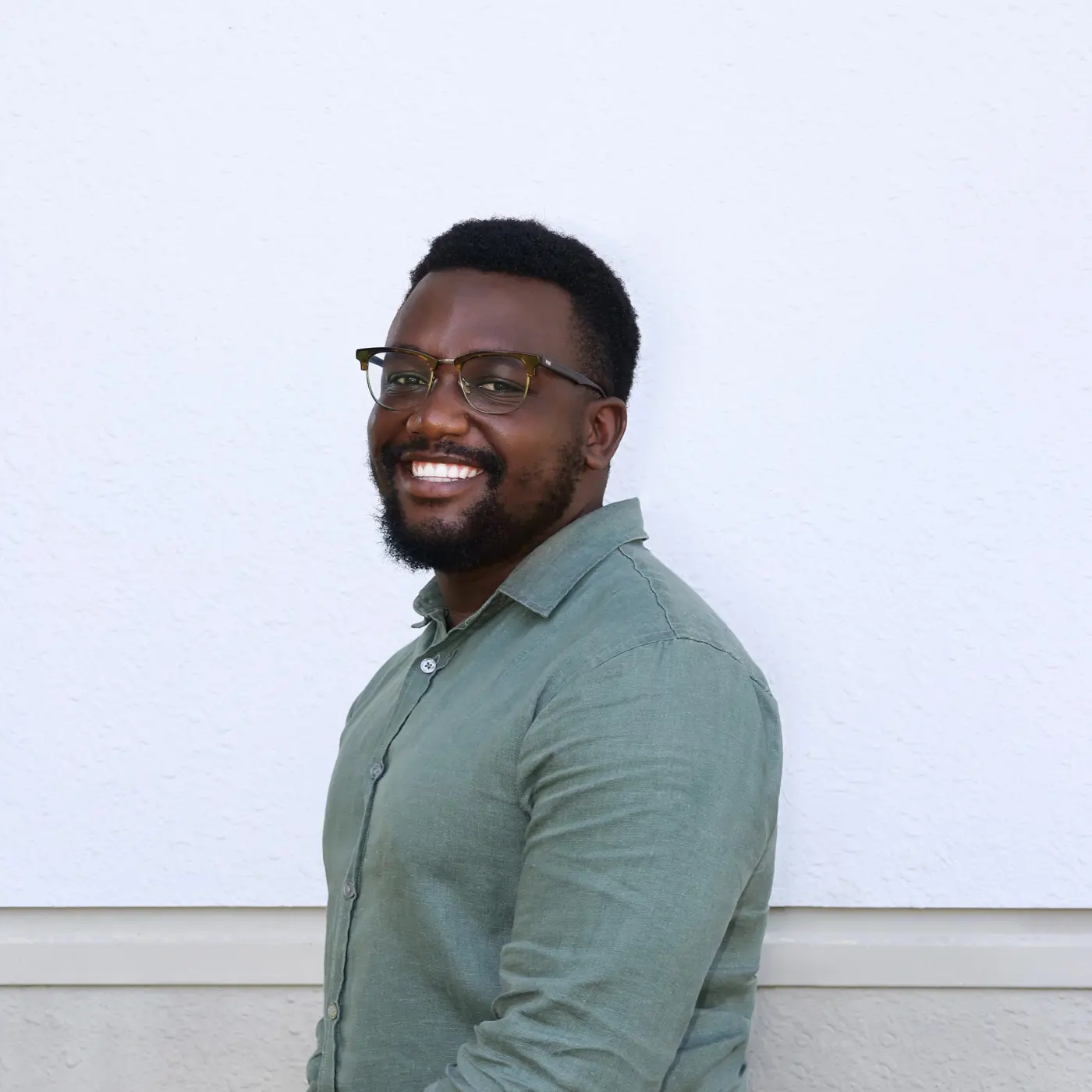 a man smiling at the camera