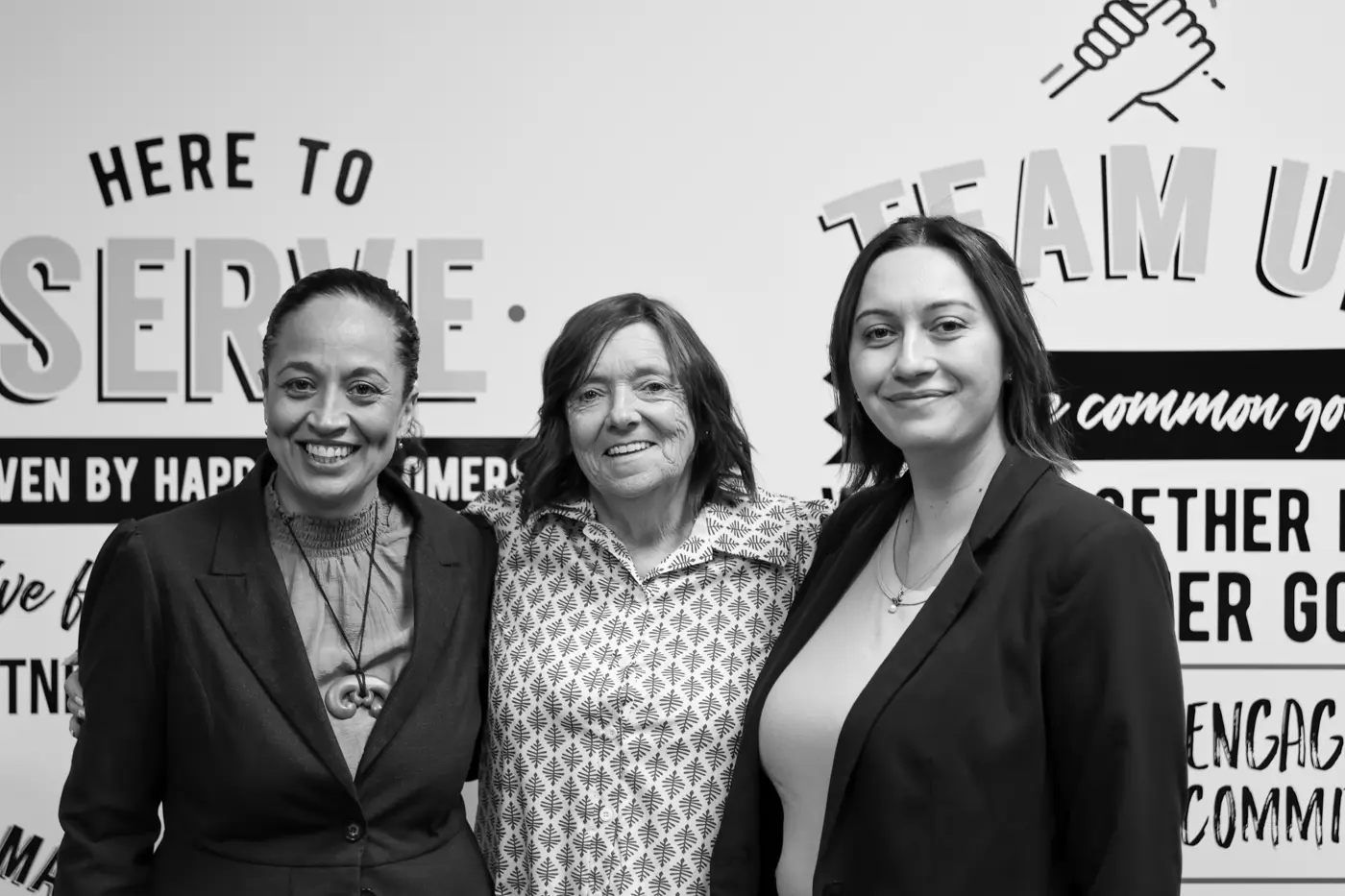 a group of women posing for a photo