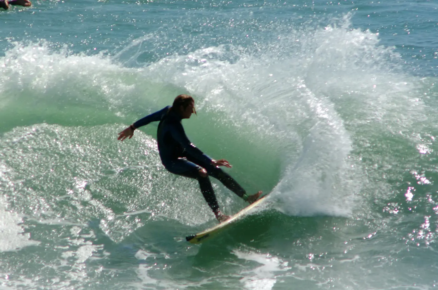 a person surfing on a wave