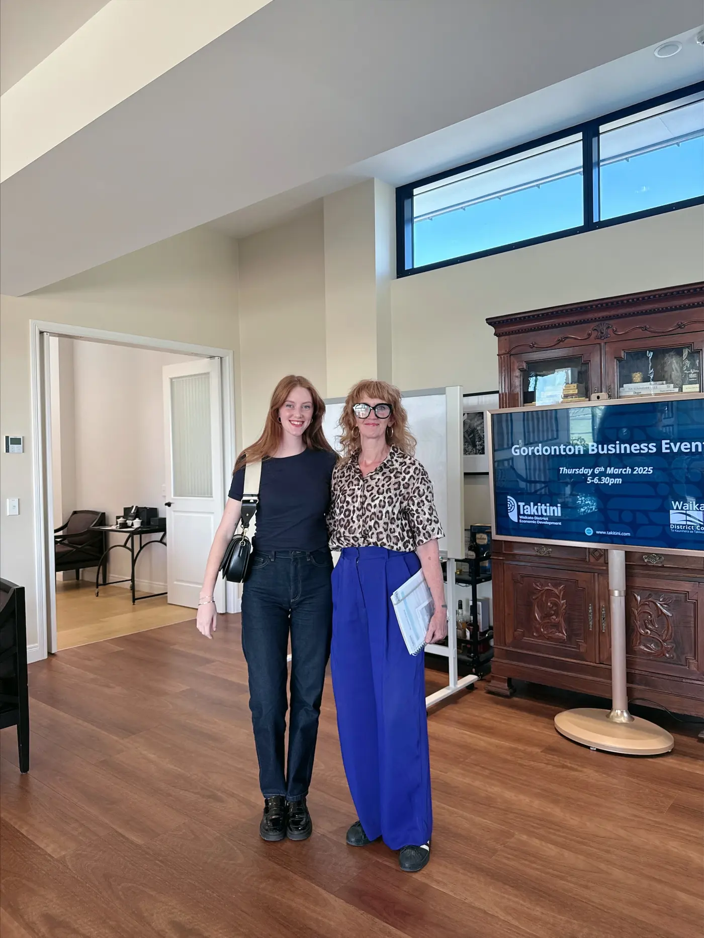 two women standing in a room