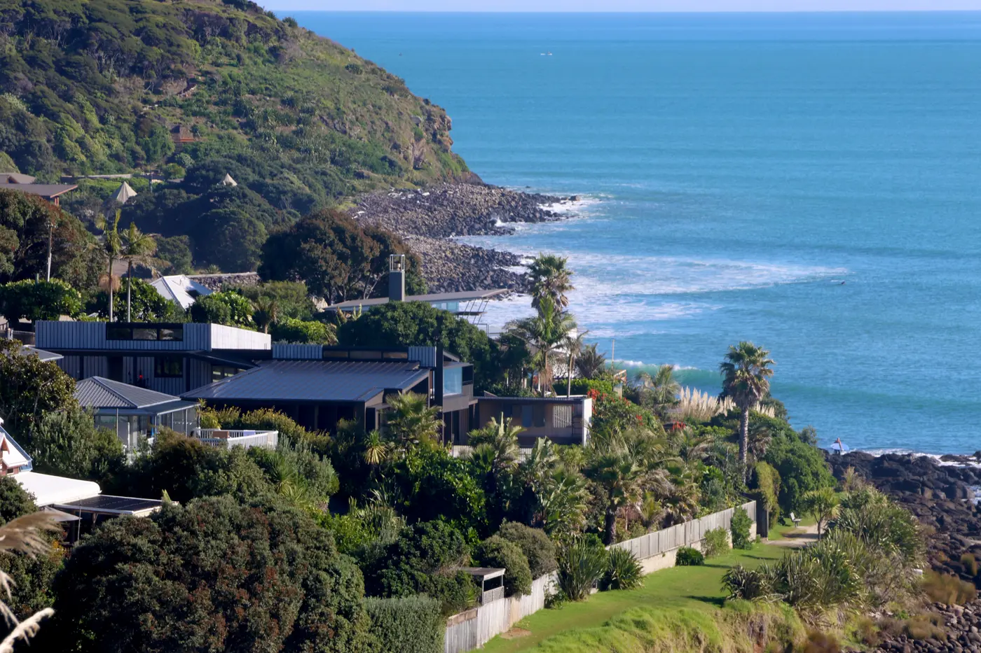 houses and a beach with a body of water